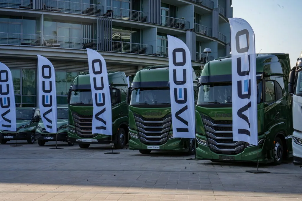 IVECO beach flags lining a truck display outside a hotel during a dealer event, Türkiye