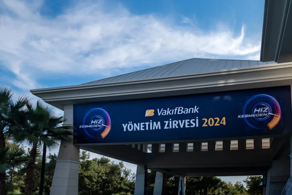 Stretched vinyl banner on a hotel canopy for the VakıfBank Management Summit 2024 at Titanic Deluxe Golf Belek, Antalya