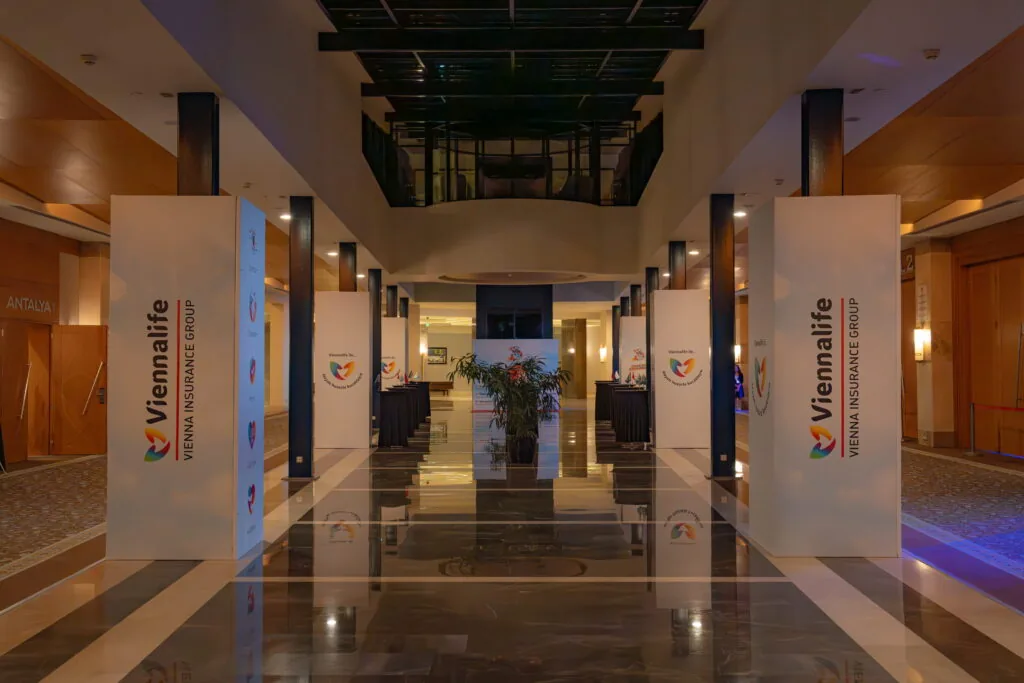 Hotel lobby with Viennalife branded column wraps along the walkway, Türkiye