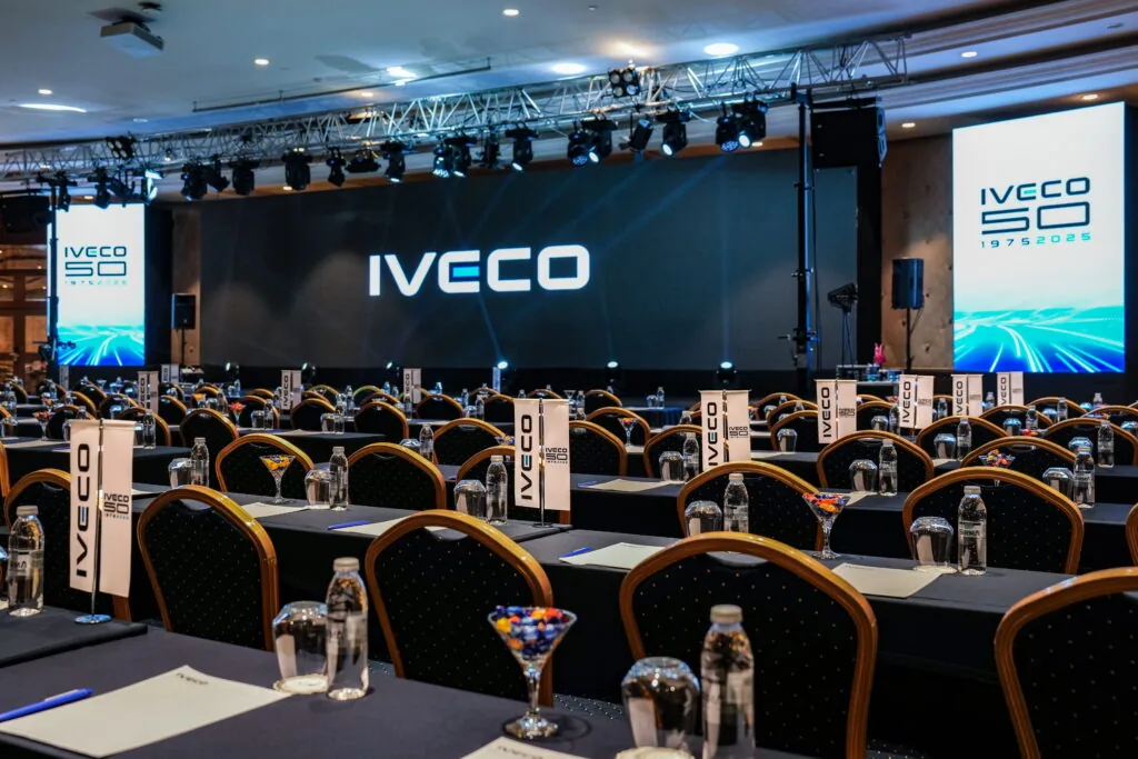 Dealer meeting conference room with IVECO 50 years LED stage and table branding, Türkiye