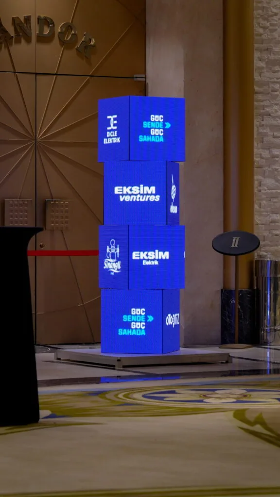 Stacked LED display cubes with Eksim branding in a hotel lobby, Türkiye