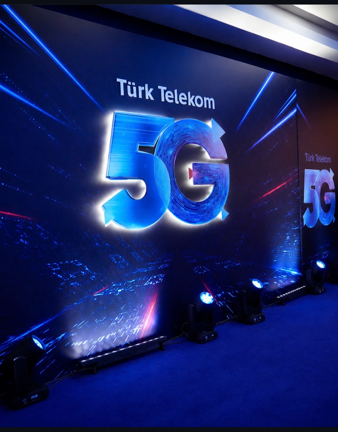 Illuminated Türk Telekom 5G wall with stage lighting at the Business Partners Meeting in Antalya